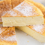 Slice of flourless cloud cake dusted with powdered sugar
