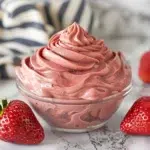 Bowl of strawberry ganache on white marble